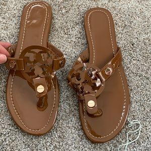 Camel colored sandals with gold hardware.